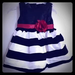Baby girls dress by Sweet Heart Rose.
